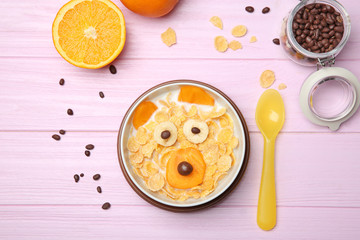 Creative breakfast for children on wooden background, top view
