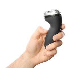 Man holding electric shaver on white background