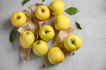 Ripe yellow apples on light background