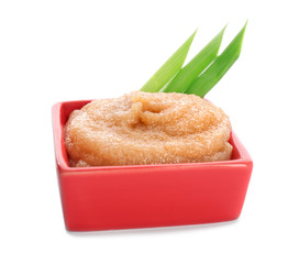 Bowl with delicious cod caviar on white background