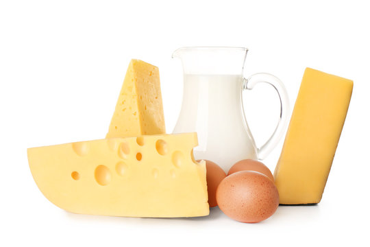 Dairy products and eggs on white background