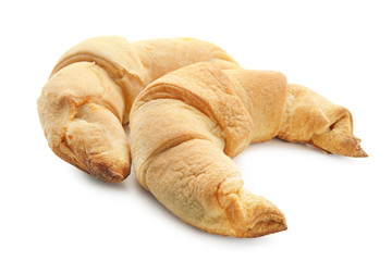 Tasty crescent rolls on white background