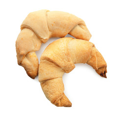 Tasty crescent rolls on white background