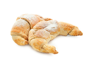 Tasty crescent rolls on white background