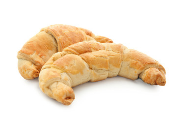 Tasty crescent rolls on white background