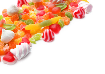 Different colorful candies on white background