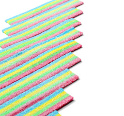 Colorful chewy candies on white background
