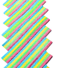 Colorful chewy candies on white background