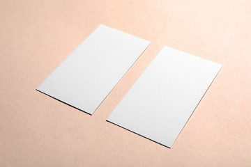 Blank business cards on color background