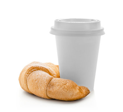 Tasty crescent roll with cup of coffee on white background