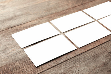 Blank business cards on wooden background