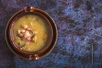 Served beef meat and beans soup in the bowl,selective focus and blank space