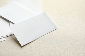 Blank business cards on light background