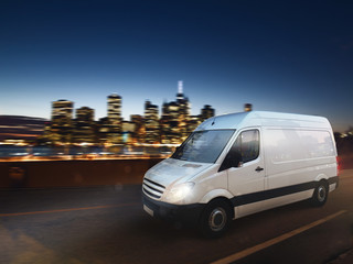 Fast van on a city road delivering at night. 3D Rendering © alphaspirit