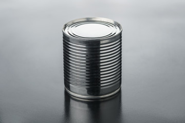 Closeup various metal tin can on black background