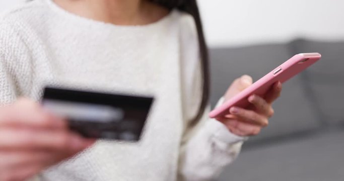 Online shopping at home with credit card and mobile phone