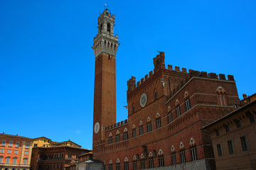 Fototapeta premium Old building with a tower in Siena, Italy 