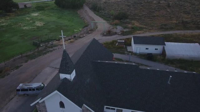 Aerial toward Christian church house.