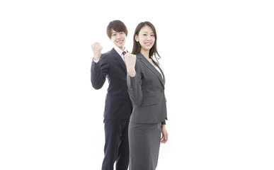 ガッツポーズをするビジネスマン＆ビジネスウーマン