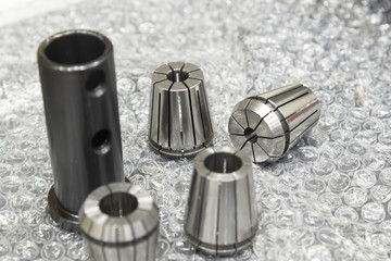 The CNC part ,collet spare parts on the floor.