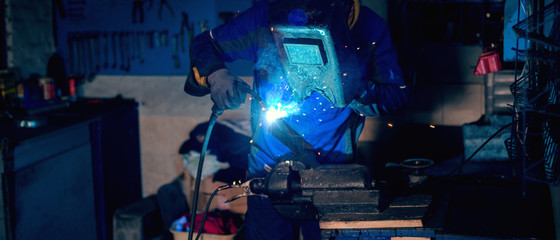 Metal welding in workshop.