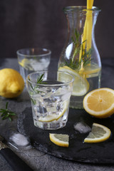 Detox water, fresh  lemonade with ice, lemon and rosemary