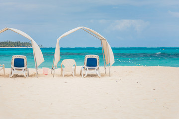 Fototapeta na wymiar Empty Sunshades on the beach