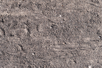sandy path road with boot tracks. background, texture.
