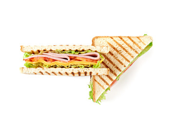 Sandwich with ham, cheese, tomatoes, lettuce, and toasted bread. Top view isolated on white background.
