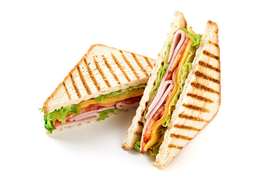 Sandwich with ham, cheese, tomatoes, lettuce, and toasted bread. Above view isolated on white background.
