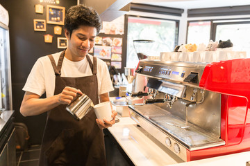 Fototapeta premium Barista made drink by coffee machine with vintage tone.