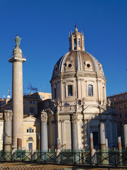 Fototapeta na wymiar Trajan's Column and Chiesa SS Nome di Maria Basilica in Rome, Italy