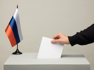 Ballot box with national flag of Russia. Presidential election in 2018. hand throwing a ballot