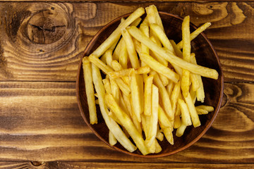 French fries on wooden table