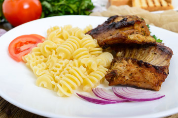 Pasta Radiatori and fried rabbit ribs.
