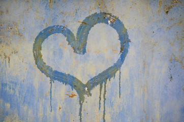 painted heart on a rusty iron background