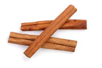 Cinnamon sticks isolated on white background. Top view