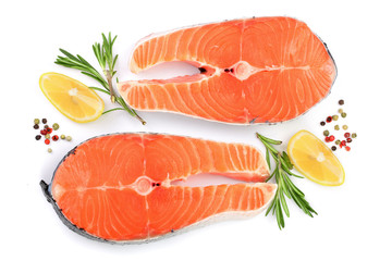 Slice of red fish salmon with lemon, rosemary and peppercorns isolated on white background. Top view. Flat lay