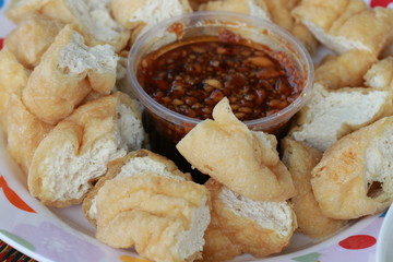 Close up fried tofu and sauce