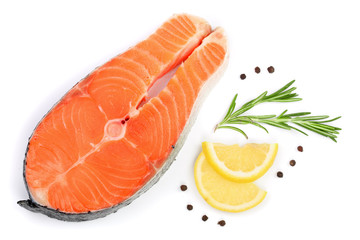 Slice of red fish salmon with lemon, rosemary and peppercorns isolated on white background. Top view. Flat lay