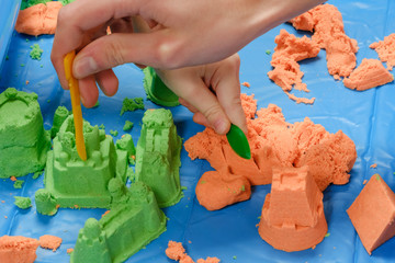 kid play kinetic sand