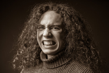 The curly guy is angry. Sepia