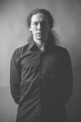 Obraz premium Young man in studio. Black and white