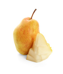 Delicious whole and sliced ripe pears on white background
