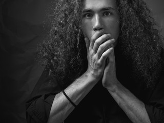 A man in fear. studio portrait. black and white