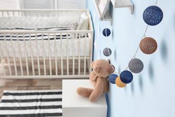Beautiful garland on wall in children room