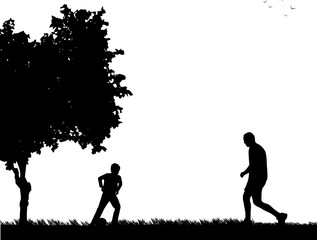 Daddy and son playing football in park, one in the series of similar images silhouette