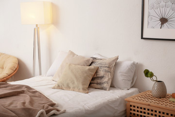 Comfortable double bed in modern stylish interior