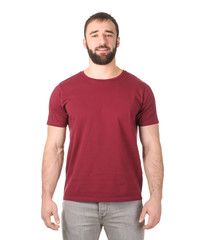 Obraz premium Young man in stylish t-shirt on white background. Mockup for design