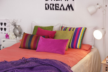 Elegant room interior with comfortable bed